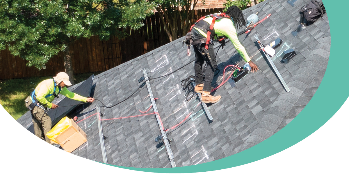 Workers installing a solar system on CoServ Member’s home. Photo by KEN OLTMANN