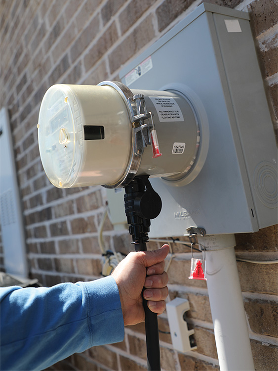 A Generlink Transfer Switch connects to the CoServ meter, allowing a portable generator to connect to your home’s circuits. Photo by KEN OLTMANN